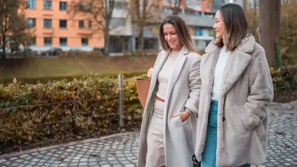 Mid Adult Companions Exchanging Stories on Autumn Day