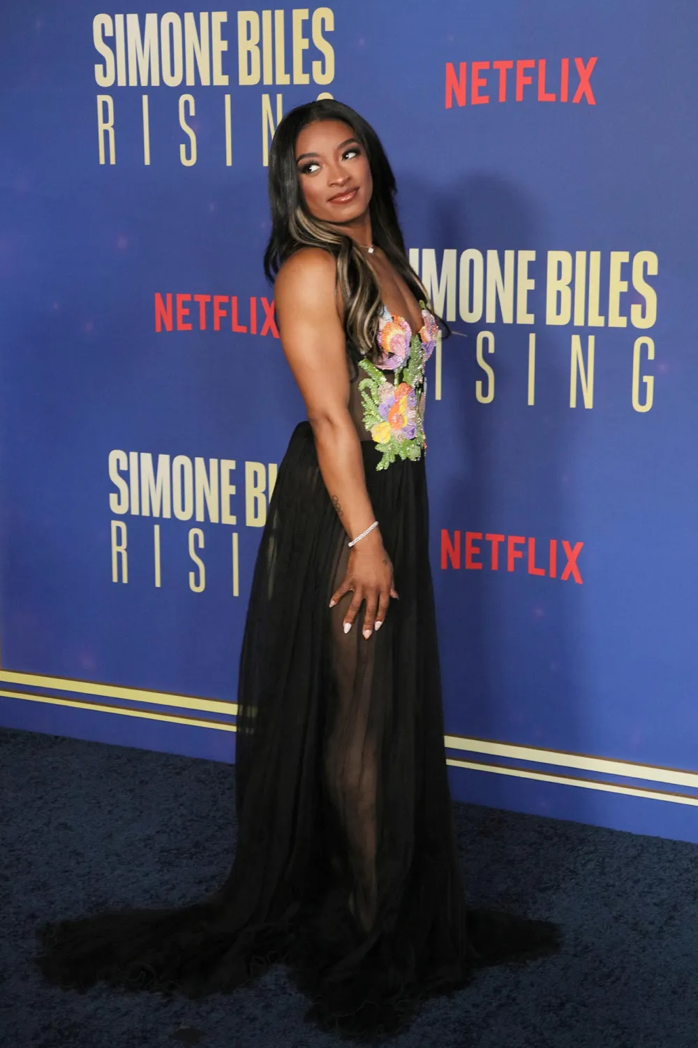 Simone Biles Gets Leggy in Sheer Skirt at Simone Biles Rising Part 2 Premiere
