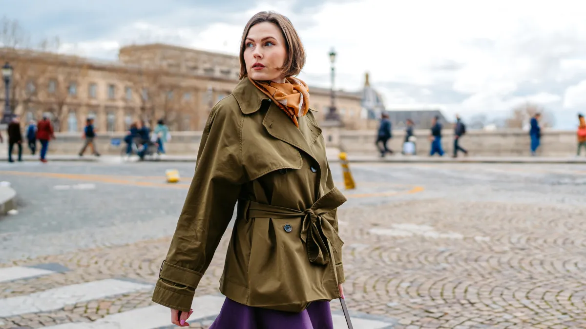 Beautiful young woman crossing the street in Paris in France.