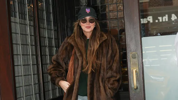 dakota johnson in brown fur jacket