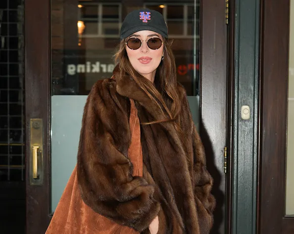 dakota johnson in brown fur jacket