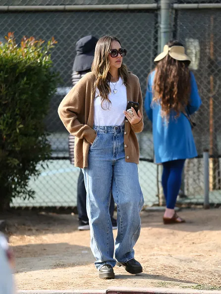 jessica alba in brown cardigan and blue jeans