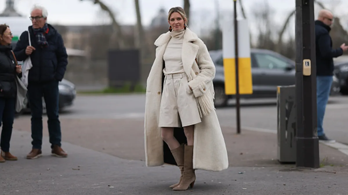 women wearing cream monochrome outfit and beige boots