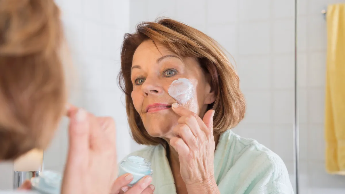 woman applying face cream