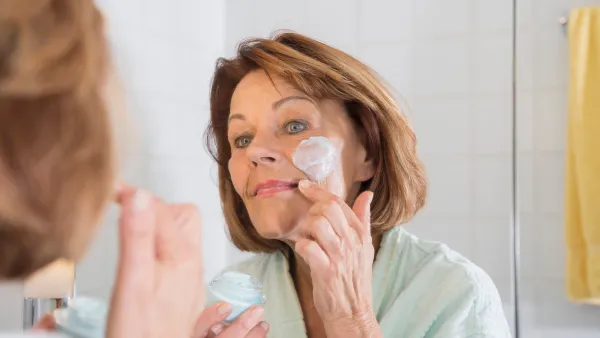 woman applying face cream