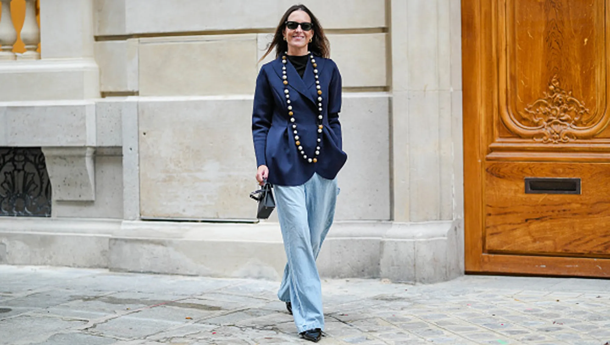 woman wearing blue top and slacks