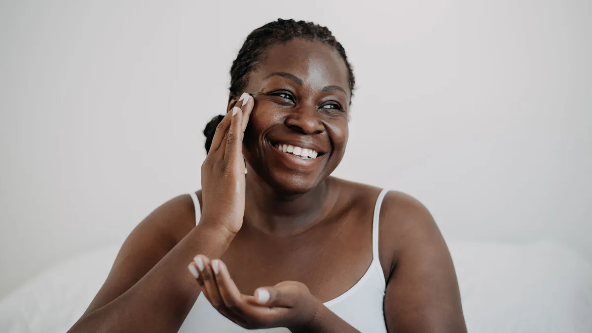 woman applying skincare