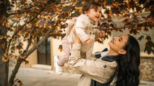 Mother and daughter playing in park,Spain