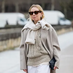 woman wearing beige sweater and coat