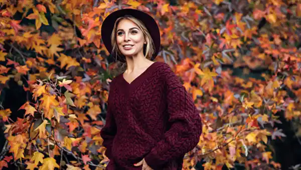 woman wearing burgundy loose sweater