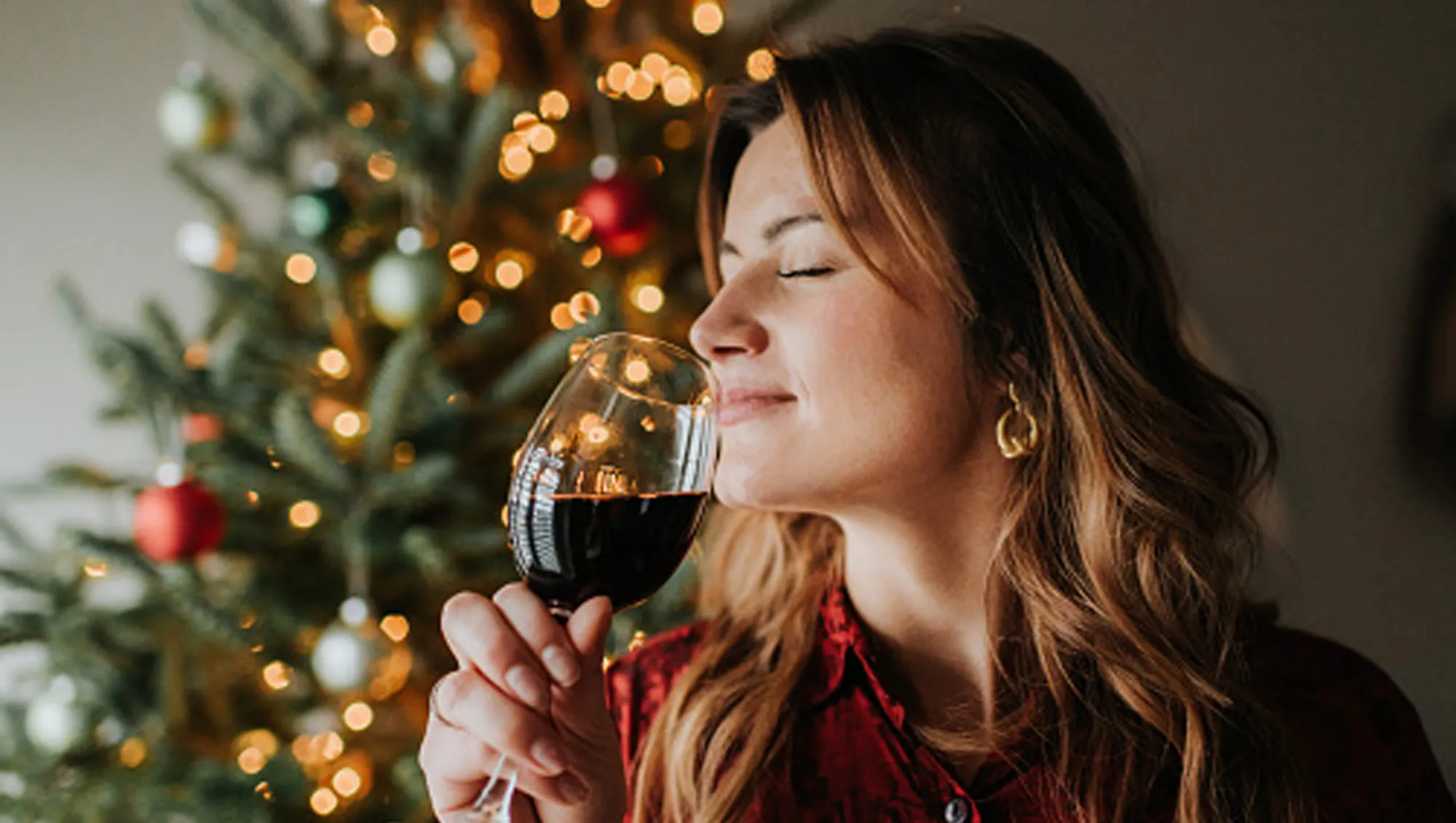 woman drinking wine during the holidays