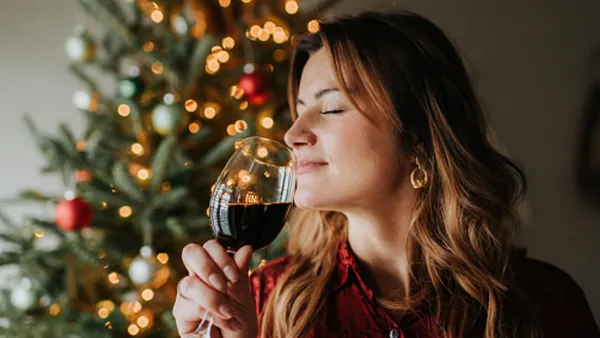 woman drinking wine during the holidays