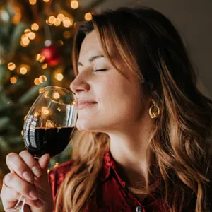 woman drinking wine during the holidays