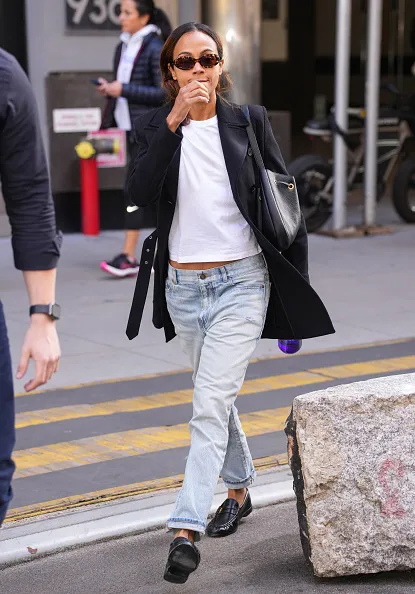zoe saldana in new york wearing blazer and jeans