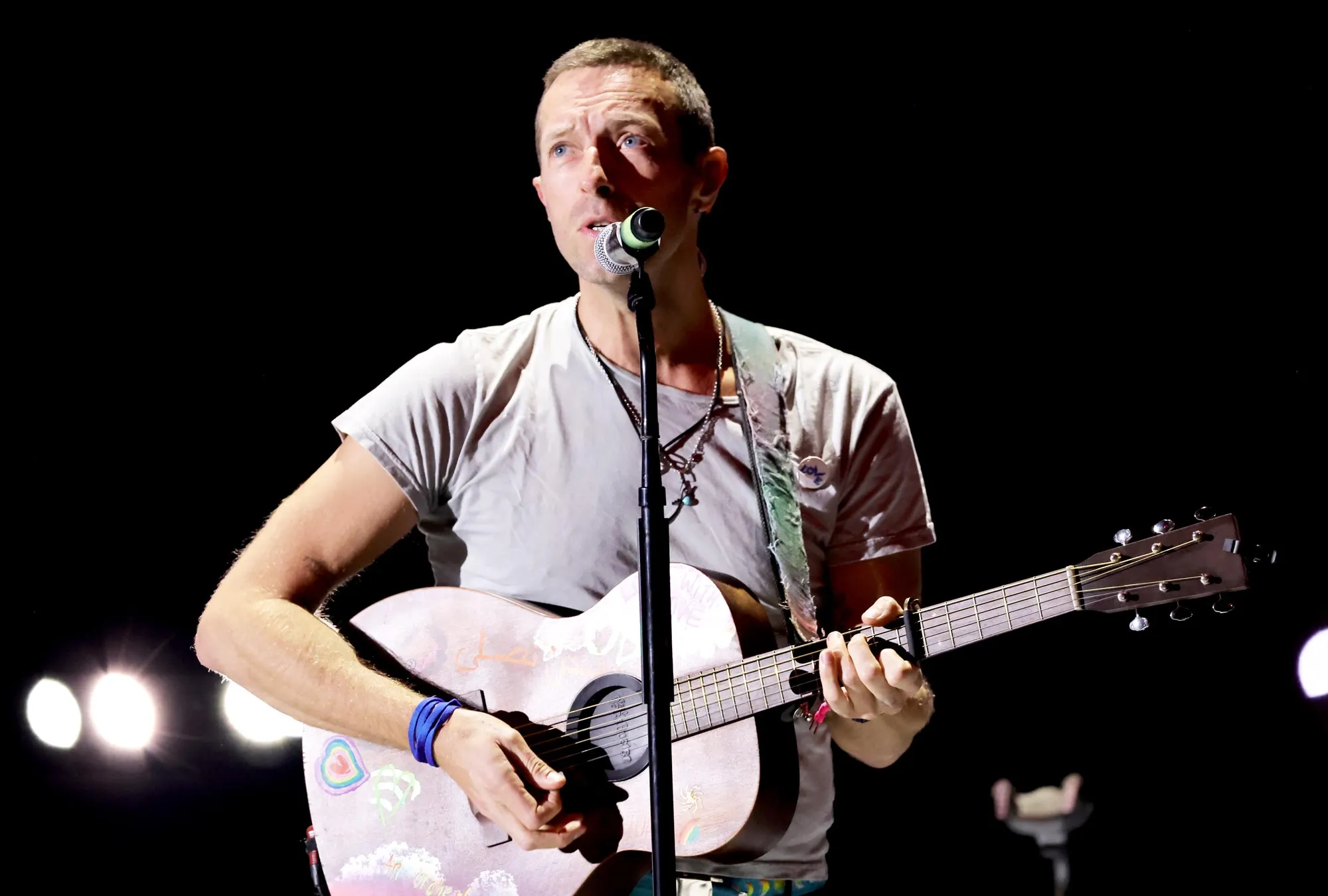 Chris Martin Rescues Young Fan From Being Squashed in Crowd