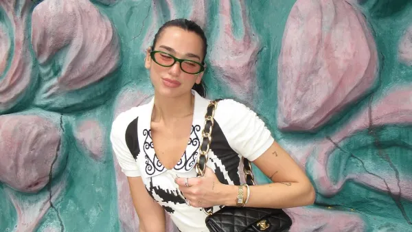 Dua Lipa Isn t Afraid to Mismatch Prints With Floral Boots With Funky Dress