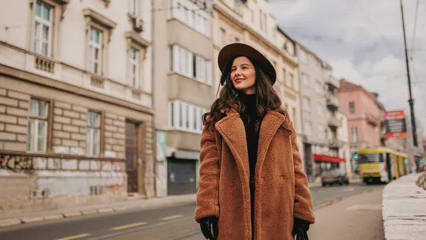 A smiling young woman at the downtown district