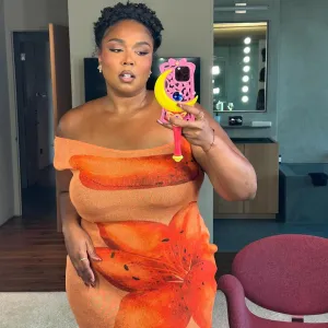 Lizzo Flaunts Her Figure in Orange Thanksgiving Outfit After Dismissing Ozempic Rumors