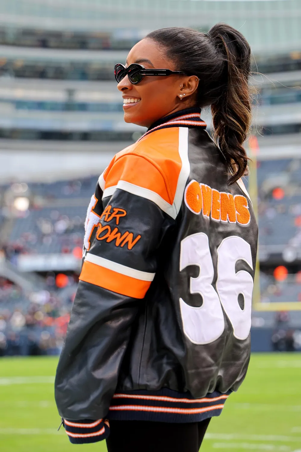 Simone Biles Struts Her Stuff in Chicago Bears Leather Jacket at Husband Jonathan Owens Game 055