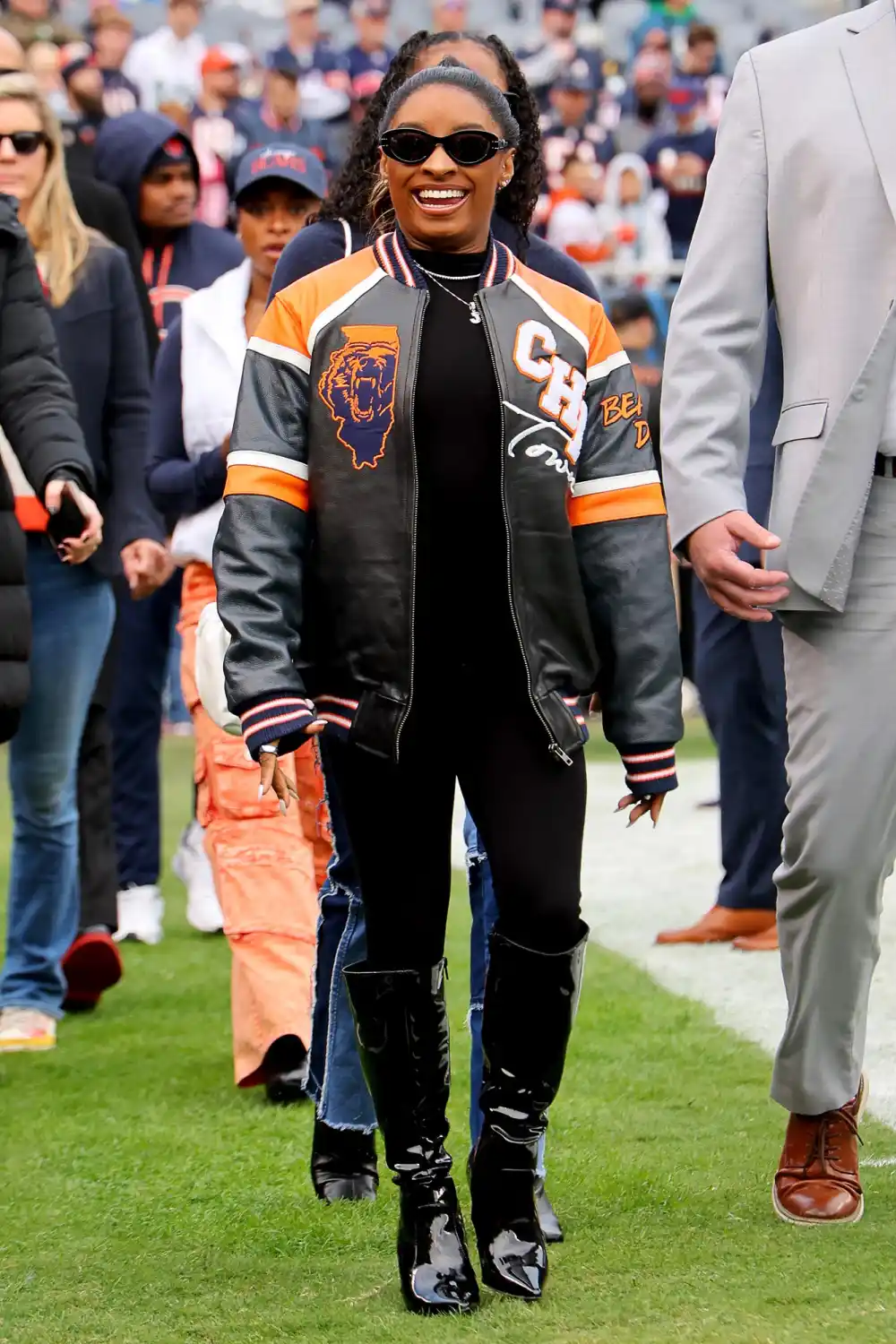 Simone Biles Struts Her Stuff in Chicago Bears Leather Jacket at Husband Jonathan Owens Game 056