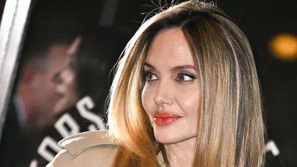 angelina jolie in beige trench coat