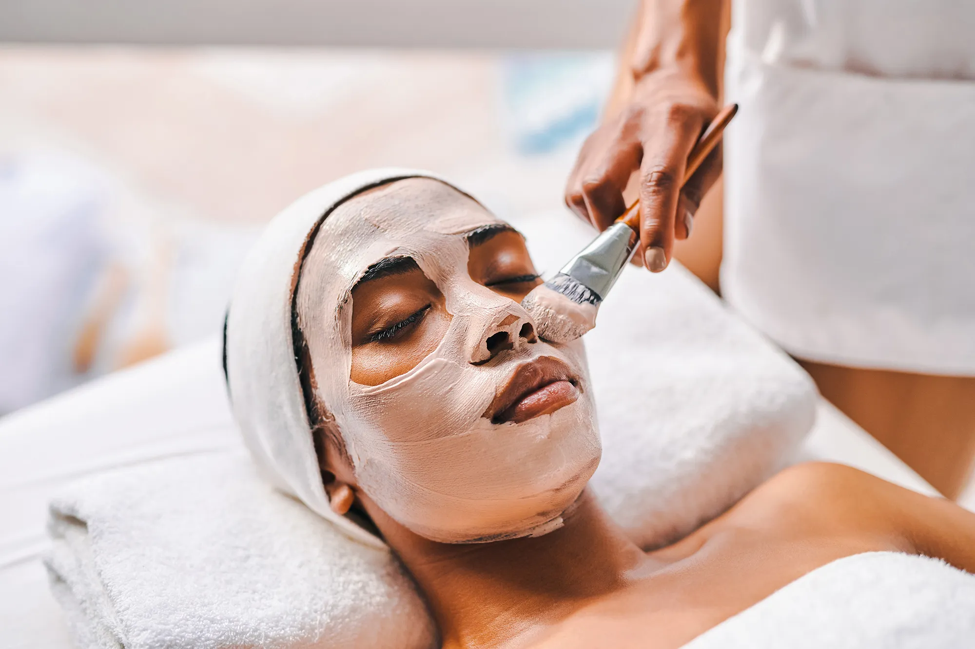 Shot of an attractive young woman getting a facial at a beauty spa