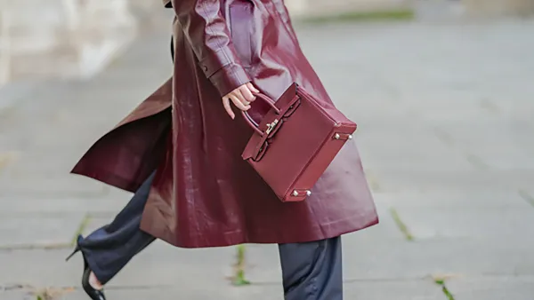 PARIS, FRANCE - NOVEMBER 11: Virginie Conte wears a burgundy leather Hermes Birkin bag, black leather Prada pointed shoes high heels, during a street style fashion photo session, on November 11, 2024 in Paris, France. (Photo by Edward Berthelot/Getty Images)