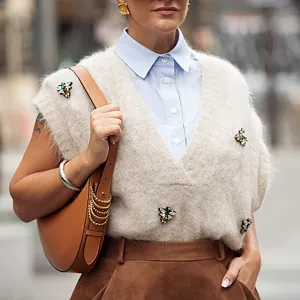 PARIS, FRANCE - SEPTEMBER 28: Gili Biegun wears brown balloon skirt, light blue shirt, beige knitted vest with accessories, brown bag outside the Vivienne Westwood show during Womenswear Spring/Summer 2025 as part of Paris Fashion Week on September 28, 2024 in Paris, France. (Photo by Raimonda Kulikauskiene/Getty Images)