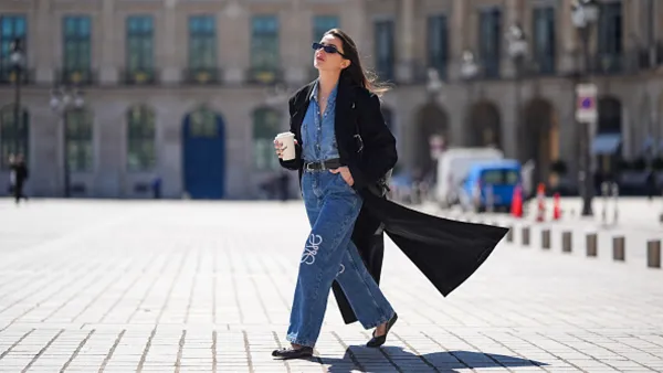 woman wearing jeans, denim top and coat
