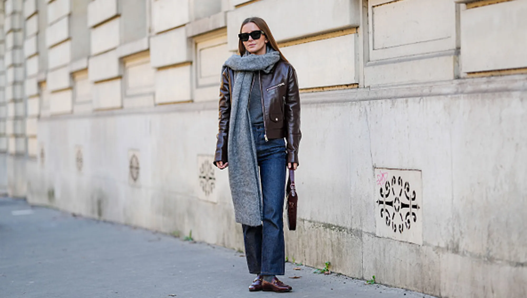 woman wearing jacket, jeans and scarf