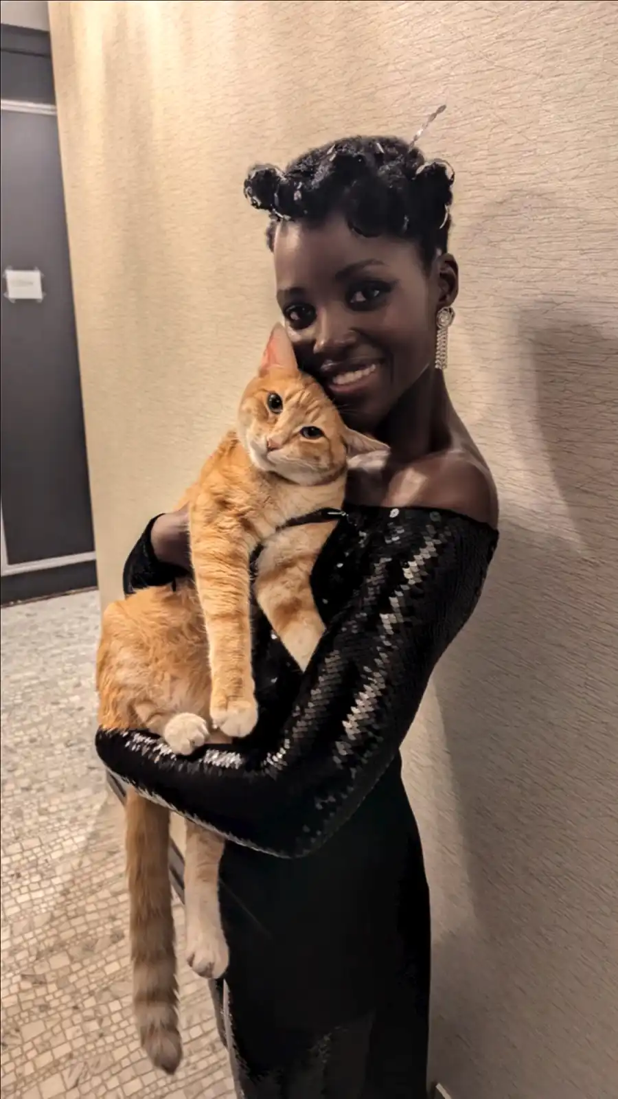 Gallery Update: Celebrities Obsessed with their cats (Lupita and YoYo)