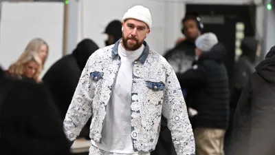 Travis Kelce High-Fives Very Excited Taylor Swift Fan in 'Eras Tour' Merch After Chiefs Game