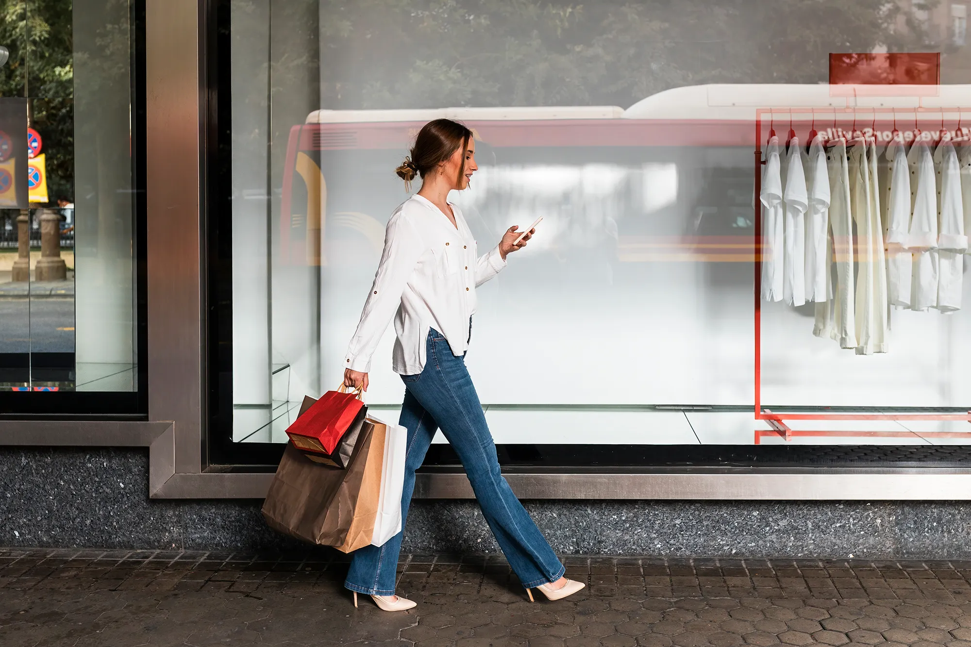 Young woman shopping in streets, Seville, Spain