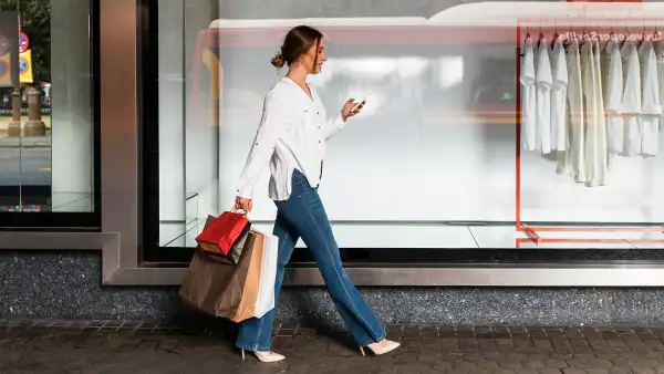 Young woman shopping in streets, Seville, Spain