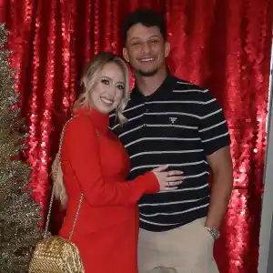 Patrick Mahomes and Pregnant Wife Brittany Cuddle Up at Chiefs Christmas Party