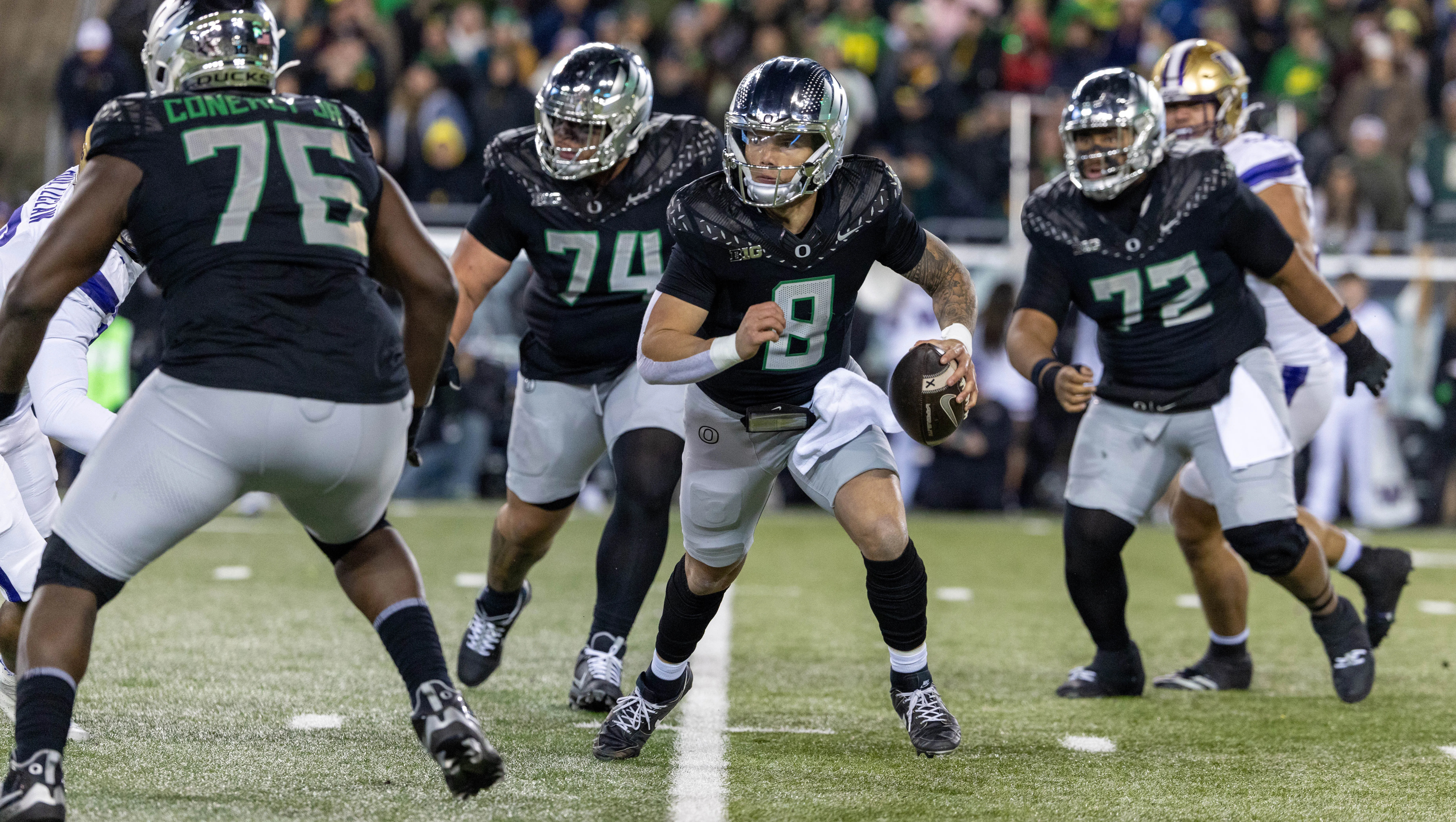 EUGENE, OREGON - NOVEMBER 30: Quarterback Dillon Gabriel #8 of the Oregon Ducks runs to pass the ball in the first half against the Washington Huskies at Autzen Stadium on November 30, 2024 in Eugene, Oregon. (Photo by Tom Hauck/Getty Images)