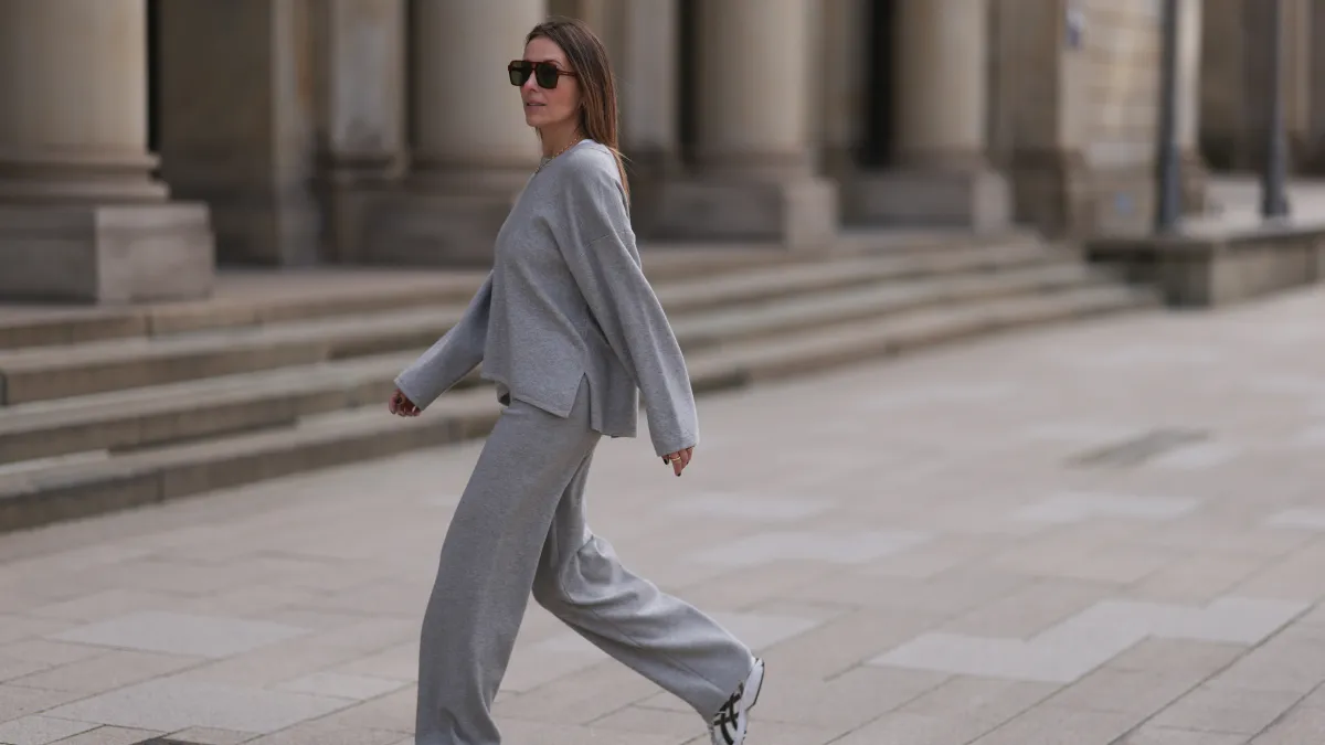 HAMBURG, GERMANY - APRIL 20: Elise Seitz seen wearing brown vintage aviator sunglasses, gold necklace, Soho Studios light grey wool knit sweater, matching Soho Studios light grey wool knit jogger pants and ASICS white / silver sneakers, on April 20, 2024 in Hamburg, Germany. (Photo by Jeremy Moeller/Getty Images)