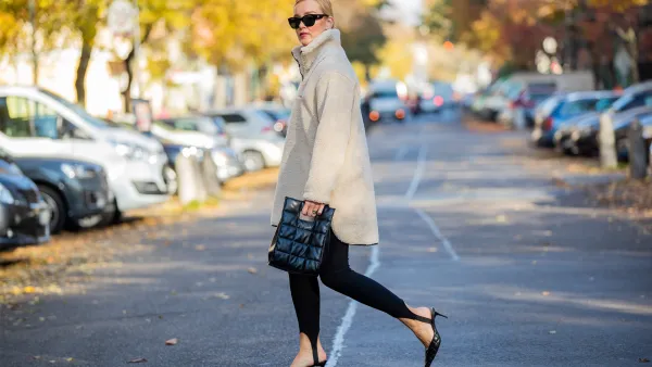Tina Haase wearing Object fleece zip sweater, Zara stirrup leggings, Skergeth bag, Chanel sunglasses, Zara heels on November 01, 2021 in Berlin, Germany.