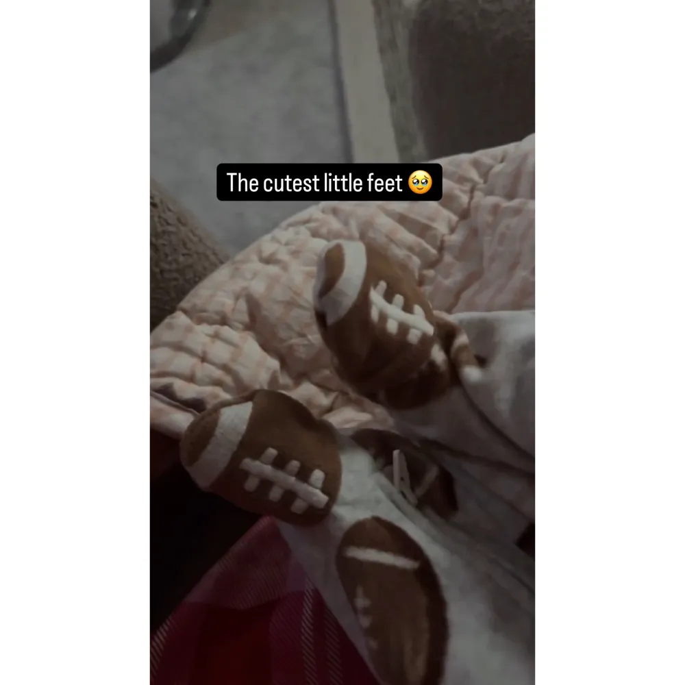 Brittany Mahomes Dresses Newborn Golden in Football Onesie 2