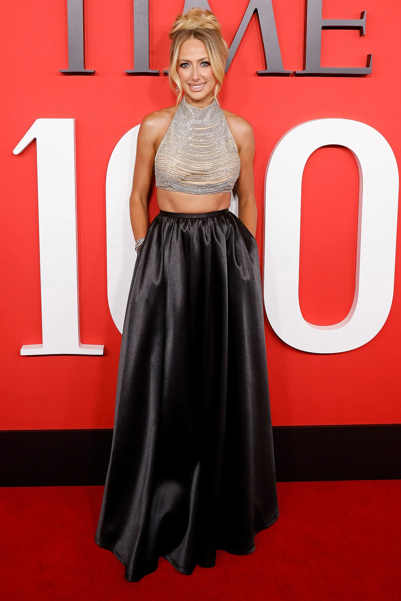 Brittany Mahomes Dresses Newborn Golden in Football Onesie