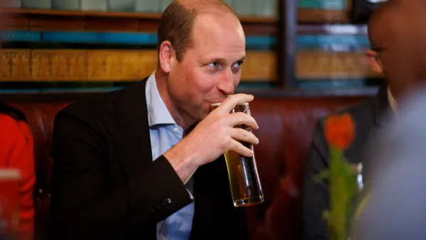Prince William sips a pint of cider.
