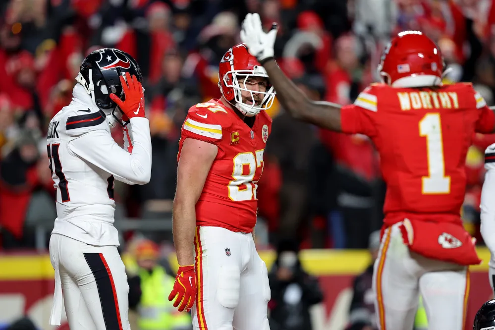 KANSAS CITY, MISSOURI - JANUARY 18: Travis Kelce #87 of the Kansas City Chiefs celebrates after scoring a touchdown against the Houston Texans during the fourth quarter in the AFC Divisional Playoff at GEHA Field at Arrowhead Stadium on January 18, 2025 in Kansas City, Missouri. (Photo by David Eulitt/Getty Images)