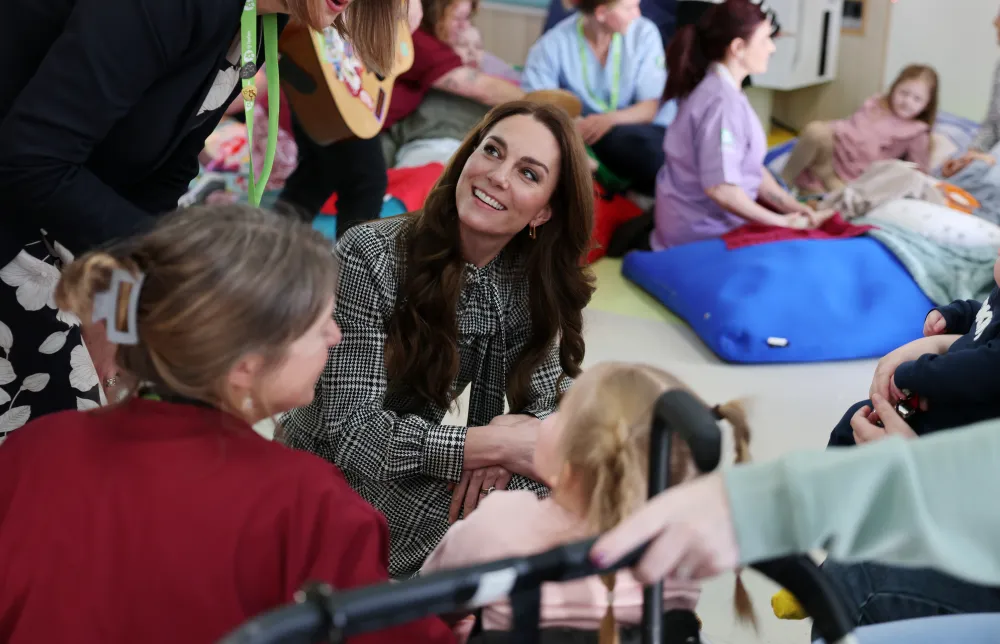 Kate Middleton plays with children