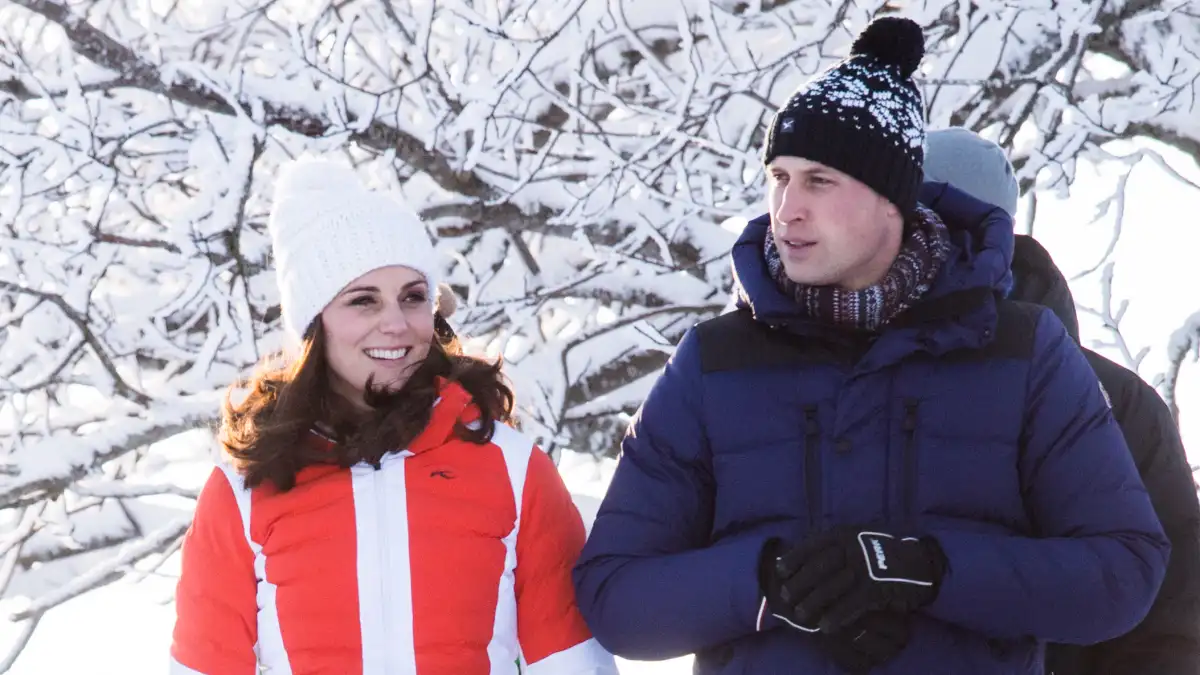 Prince William and Kate Middleton wearing winter clothes.