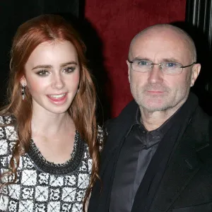 93180544 Lily Collins Shares Rare Photo of Dad Phil Collins on His 74th Birthday