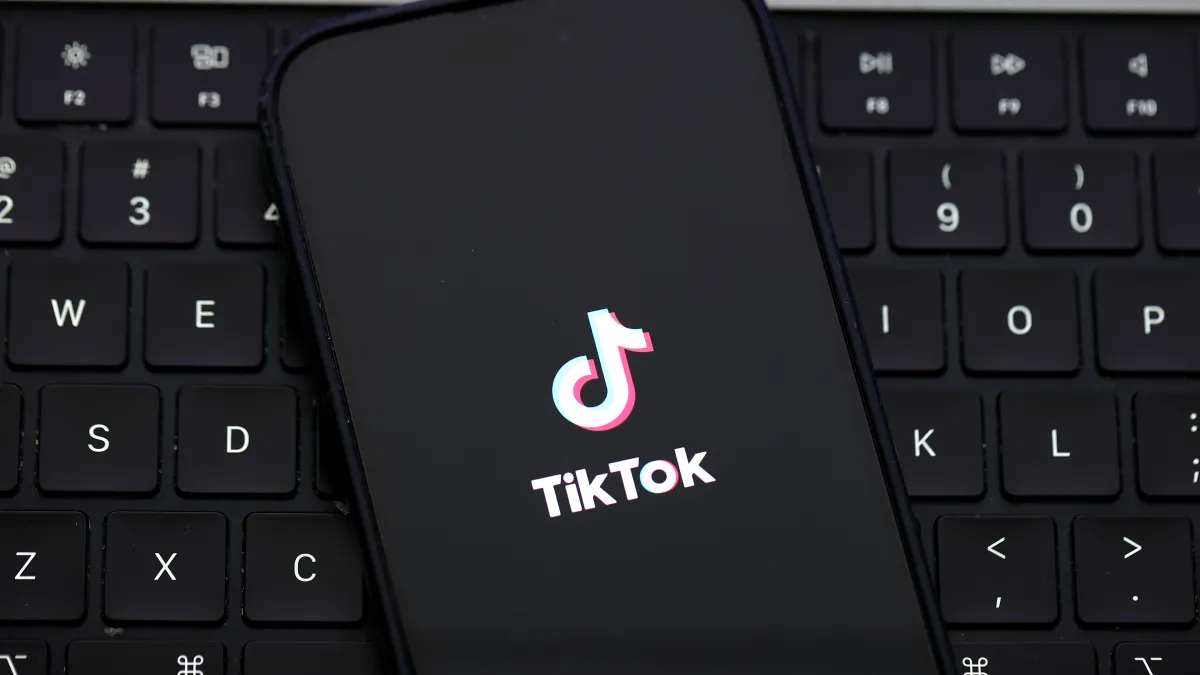 SAN ANSELMO, CALIFORNIA - DECEMBER 06: In this photo illustration, the TikTok logo is displayed on an iPhone screen on December 06, 2024 in San Anselmo, California. A three-judge panel of the U.S. Court of Appeals in Washington, D.C., has upheld a law mandating China-based ByteDance to sell the popular social media app TikTok or face a ban in the United States. ByteDance has until January 19, 2025 to sell the company. (Photo Illustration by Justin Sullivan/Getty Images)