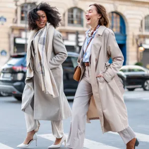 Mature Caucasian And Young Black Businesswomen Confidently Crossing City Street - stock photo