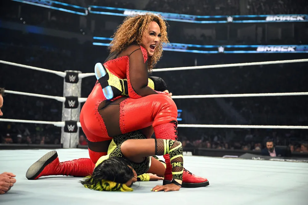 WWE s Nia Jax Jokes There Are a Couple People She d Like to Kick Out of Women s Locker Room 103