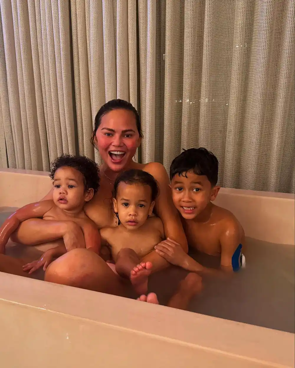 Chrissy Teigen Defends Taking Coconut Milk Bath With Kids 063