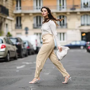 woman wearing white blouse and beige pants